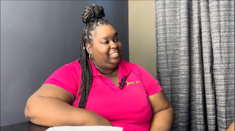 Felicia presenting on camera.