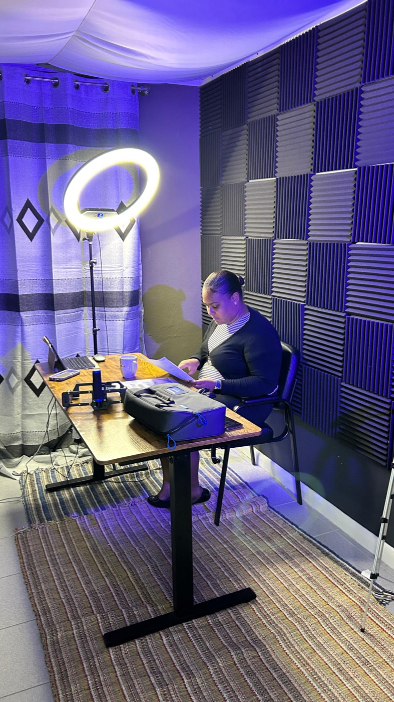 The Mangra Studios podcast suite, lit and set for a two-person recording.